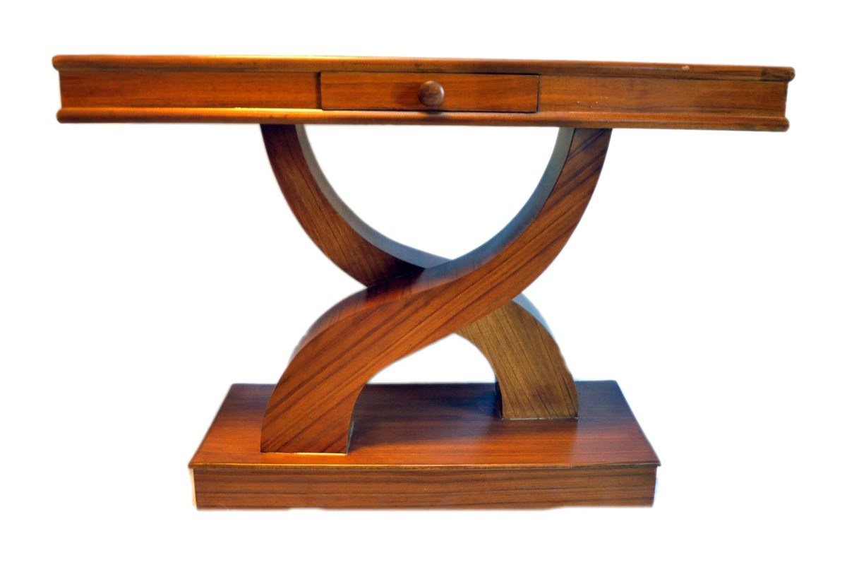 An Art Deco console table by Carpenters Choice — a single drawer over crossed, curved supports on a plinth