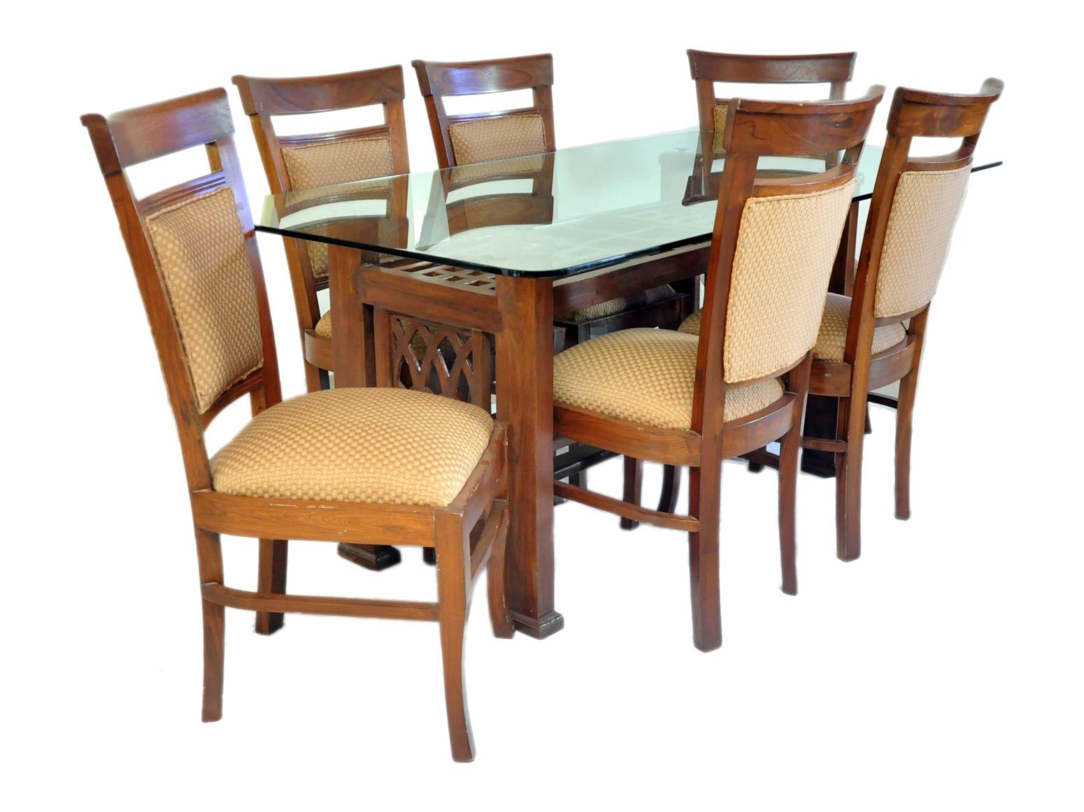 Dining table for six by Carpenters Choice — glass top on a lattice-panelled base; chairs upholstered in seat and back