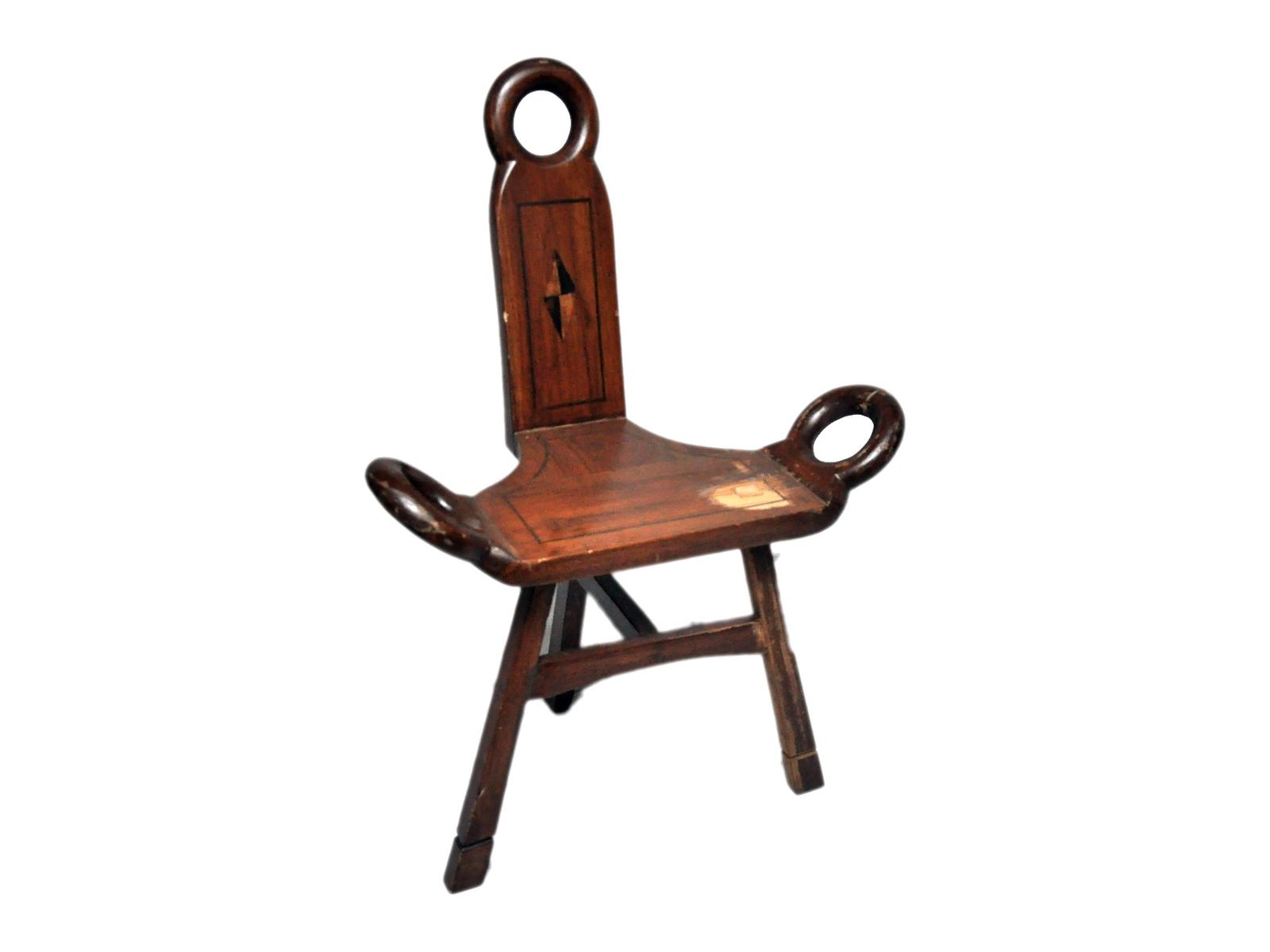 Three-legged chair by Carpenters Choice — inlaid back and ring handholds on a tripod base